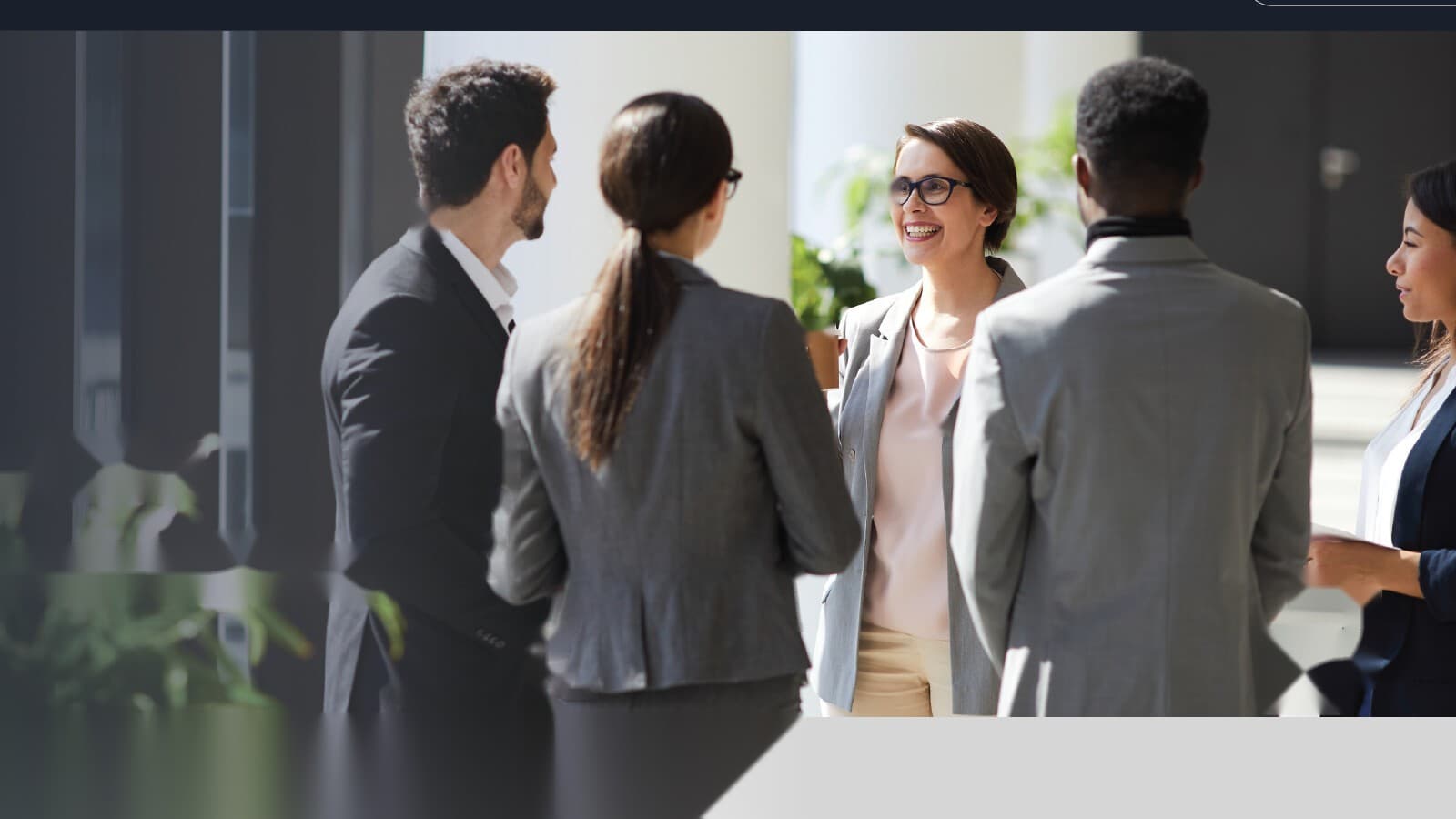 Team of professionals conversing in a bright office